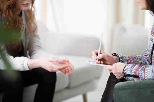 Person in counseling discussing relationship challenges during alcohol recovery.
