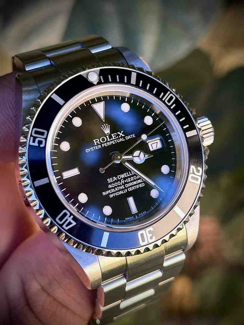 Rolex in hand. Rolex in hand.