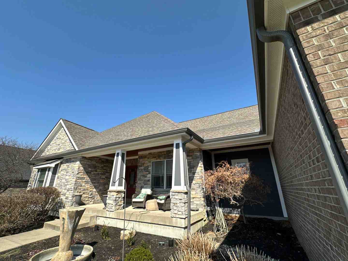 friendly roofer discussing an estimate with a homeowner - free roofing estimate waynesville oh