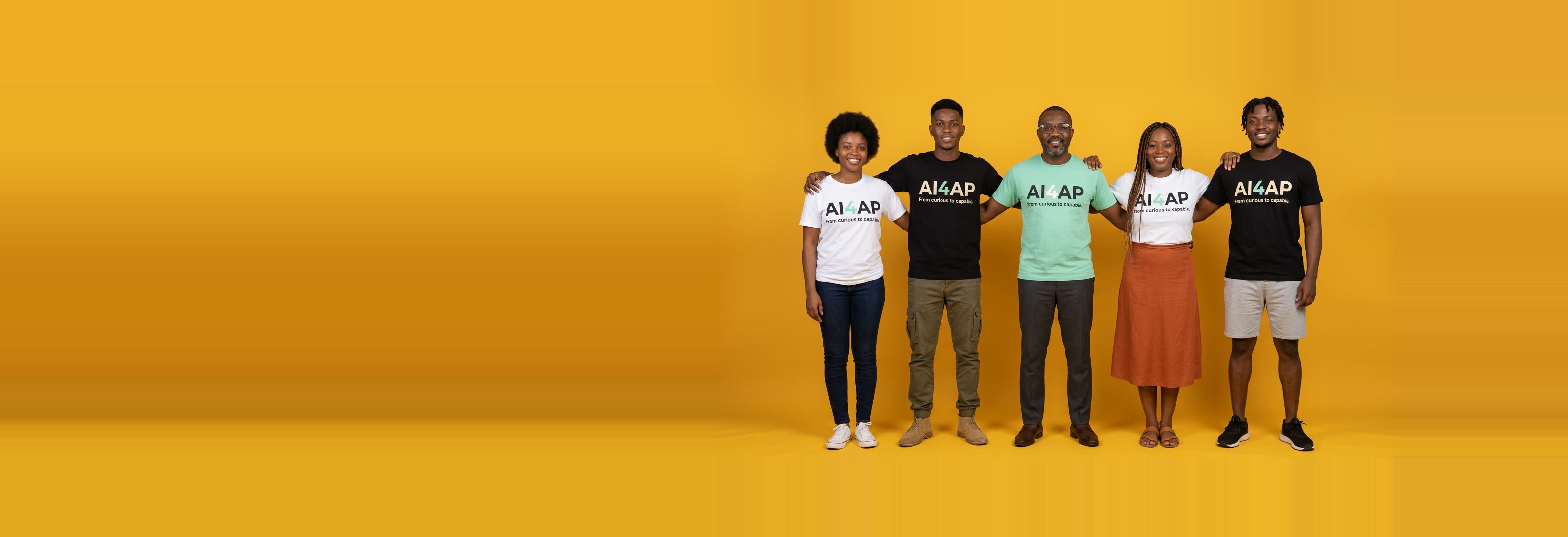 Five people standing side by side in AI For All Project t-shirts against a yellow backdrop.
