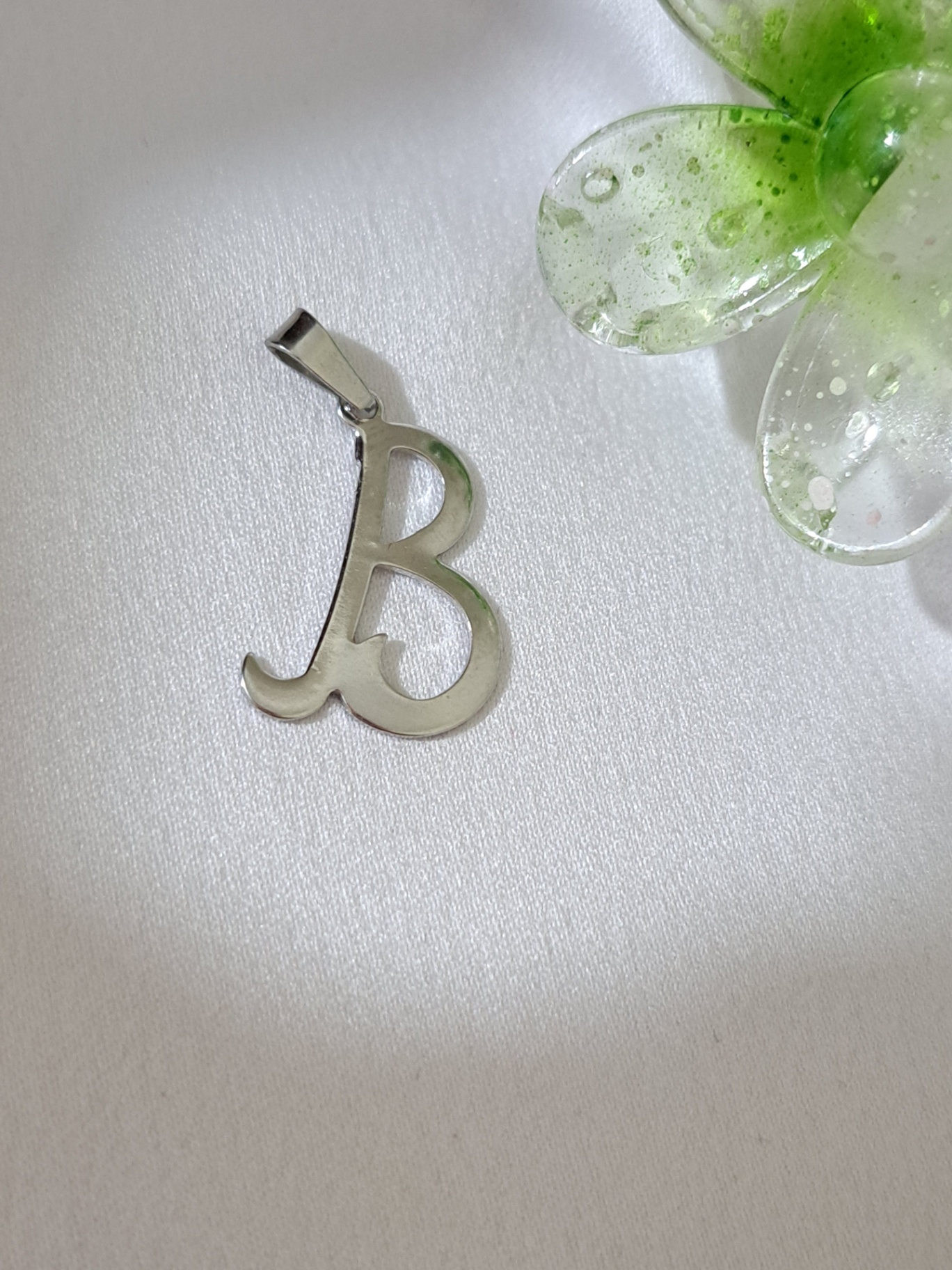 Foto de pingente letras cursivas em aço inox