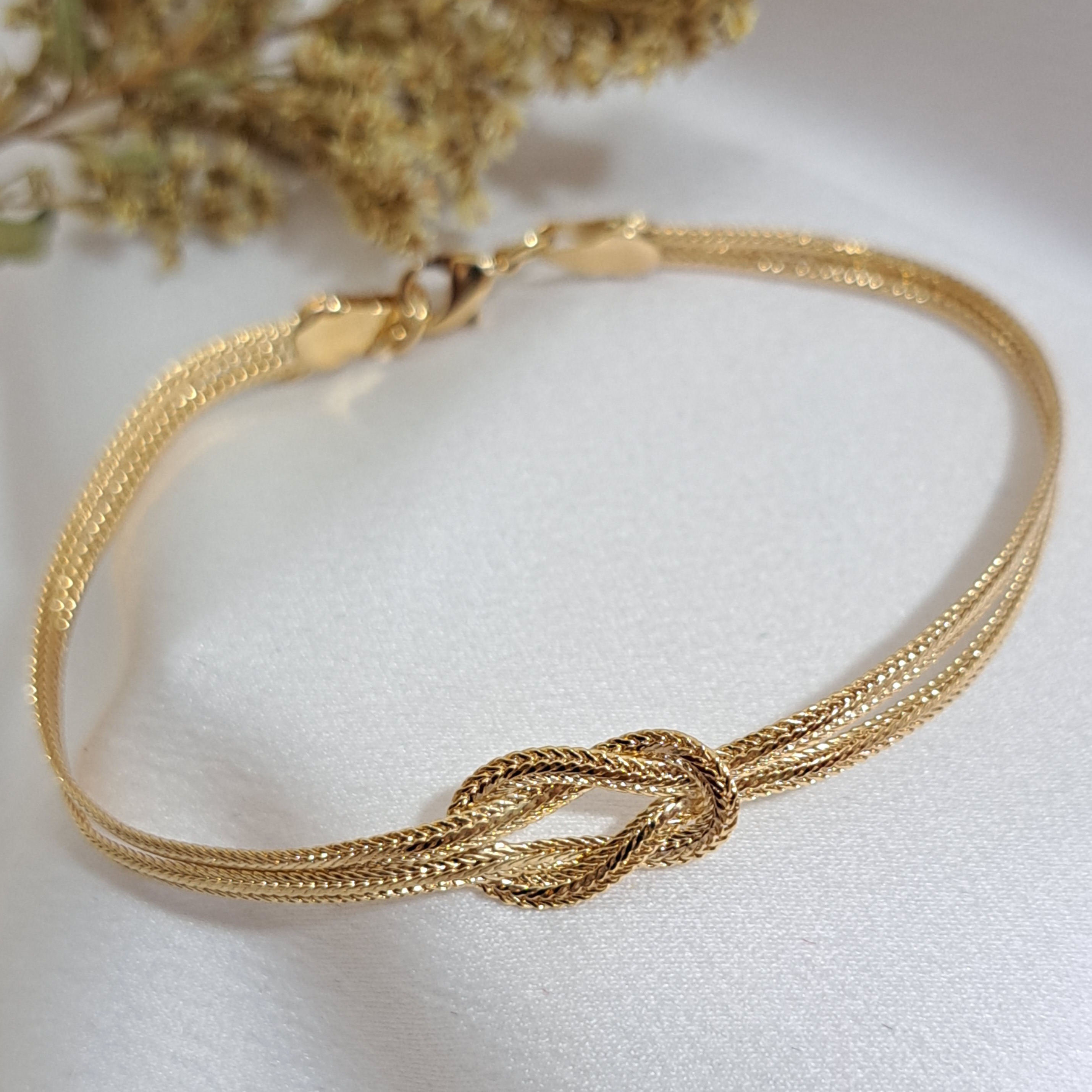 Foto de pulseira dois fios com um nó