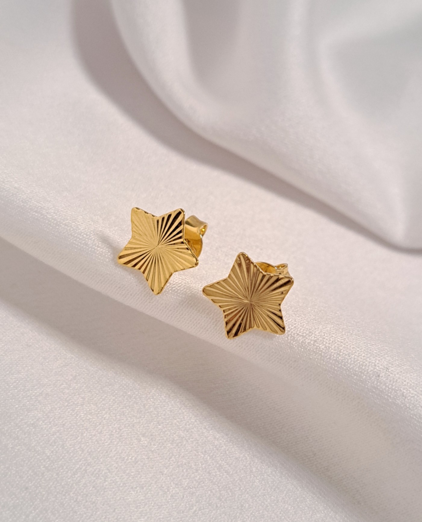 Foto de brinco estrela diamantada de 11mm