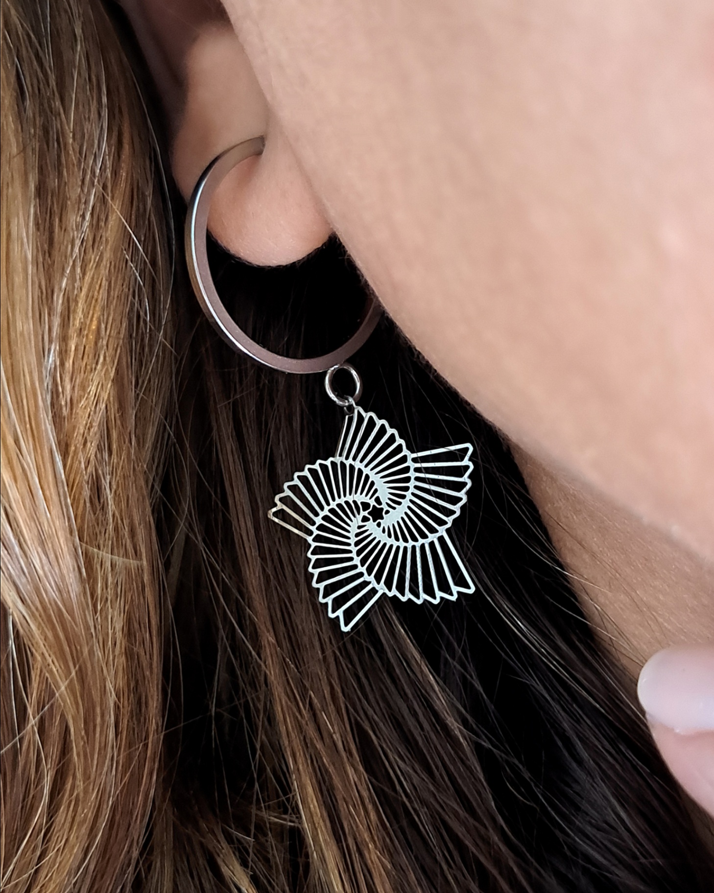 Foto de argola estrela espiral em aço inox