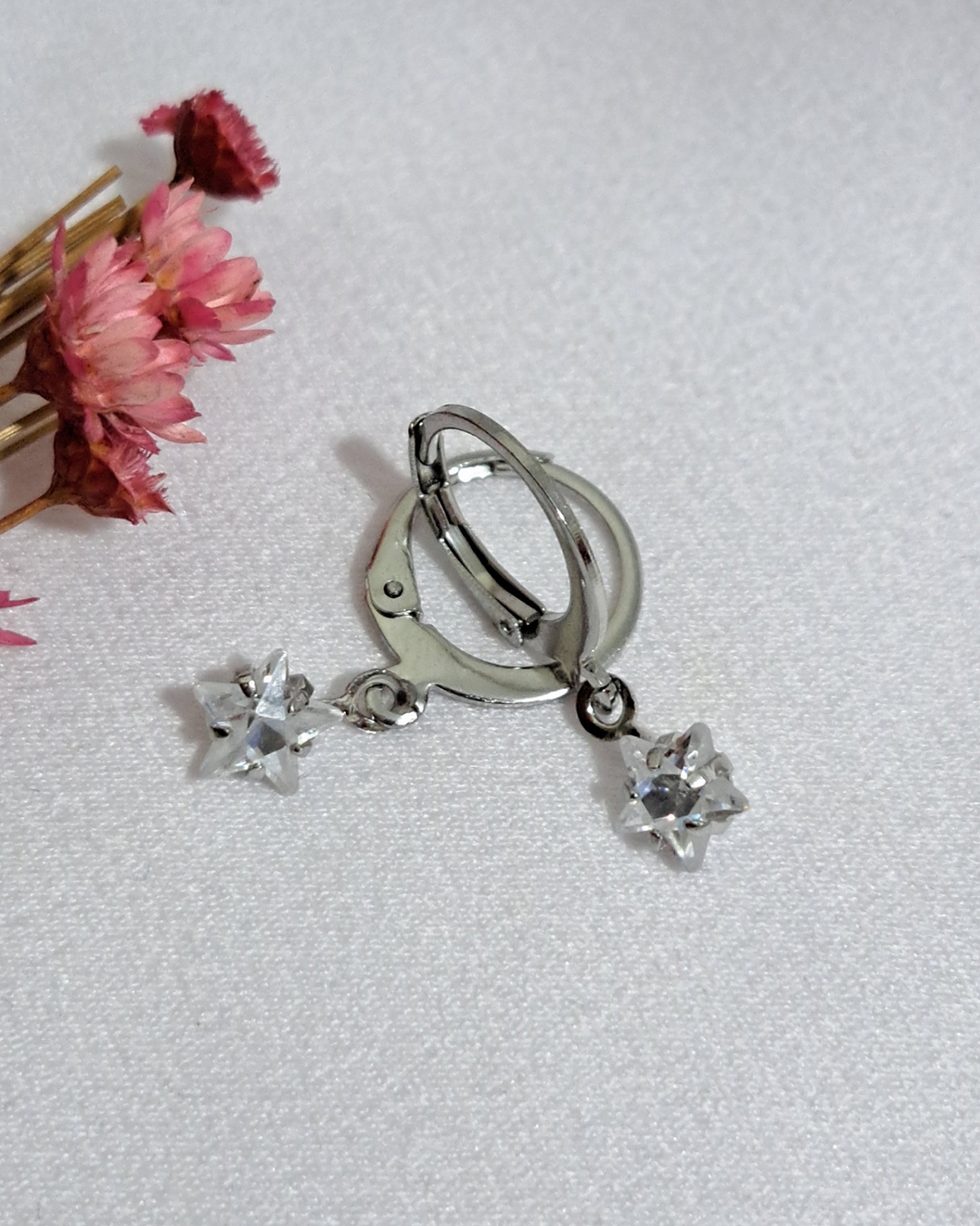 Foto de trio de brincos com pedra estrela aço inox