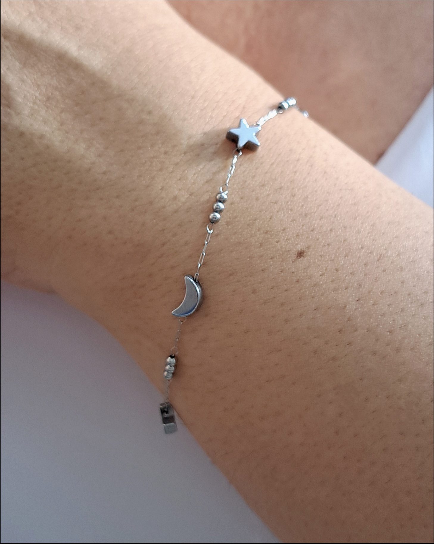 Foto de pulseira lua e estrela 3d em aço inox