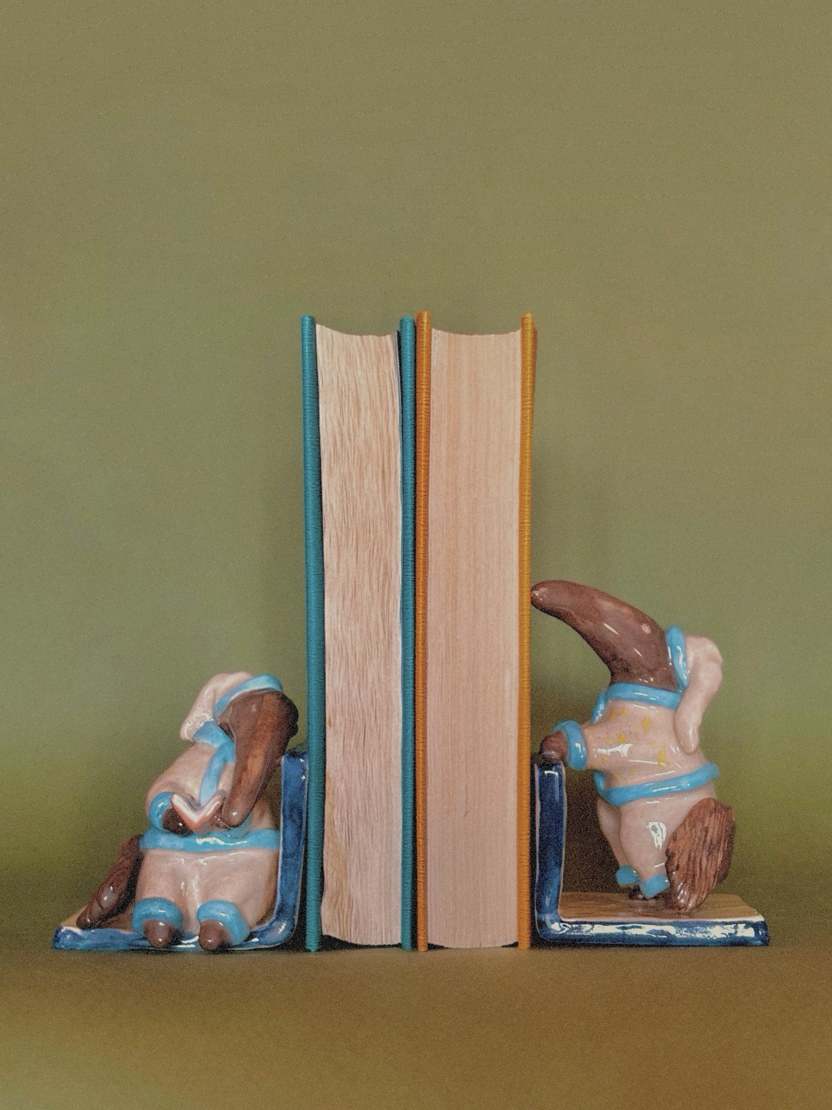 ‘Sleepy anteaters’ bookends — handmade ceramic sculpture by Alisa Merenfeld