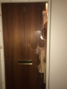 Damaged Door In Need Of Burglary Repairs - Door Services