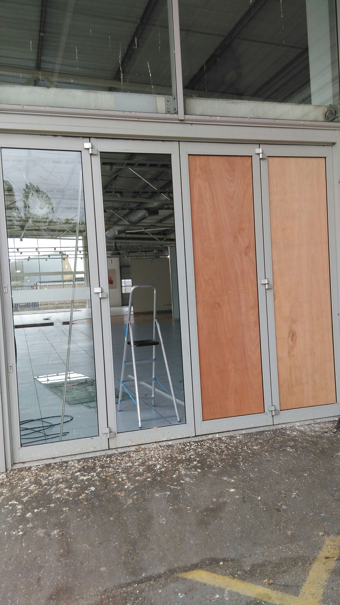 Door boarding up at car showroom