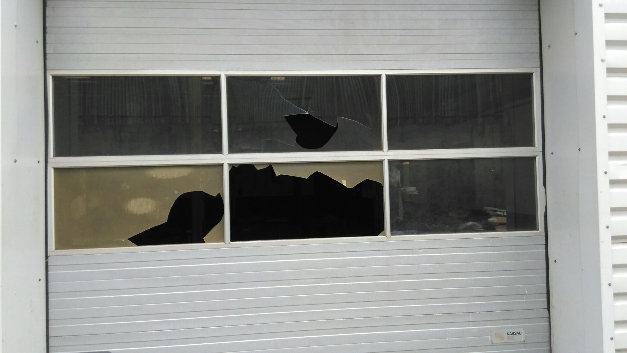 null Broken windows at car showroom