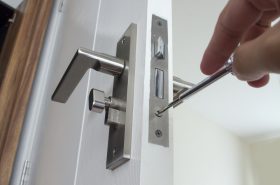 A locksmith working on a lock - what is a fair lock change price?