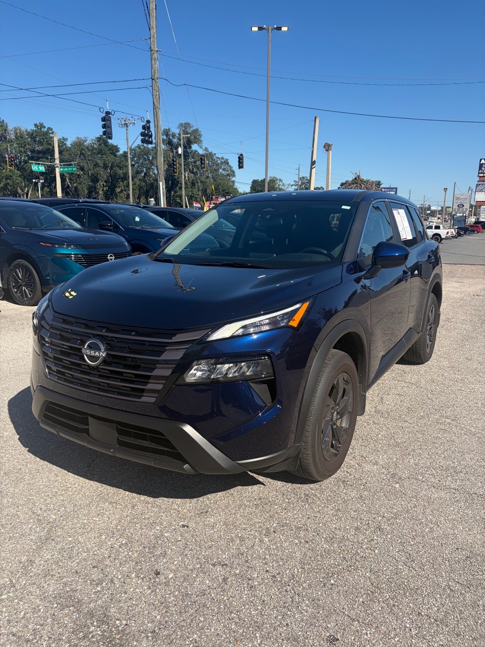 2026 Nissan Rogue SV — Deep Ocean Blue Pearl exterior view 3, for sale at Cbrasfield 36 in Lake City, FL