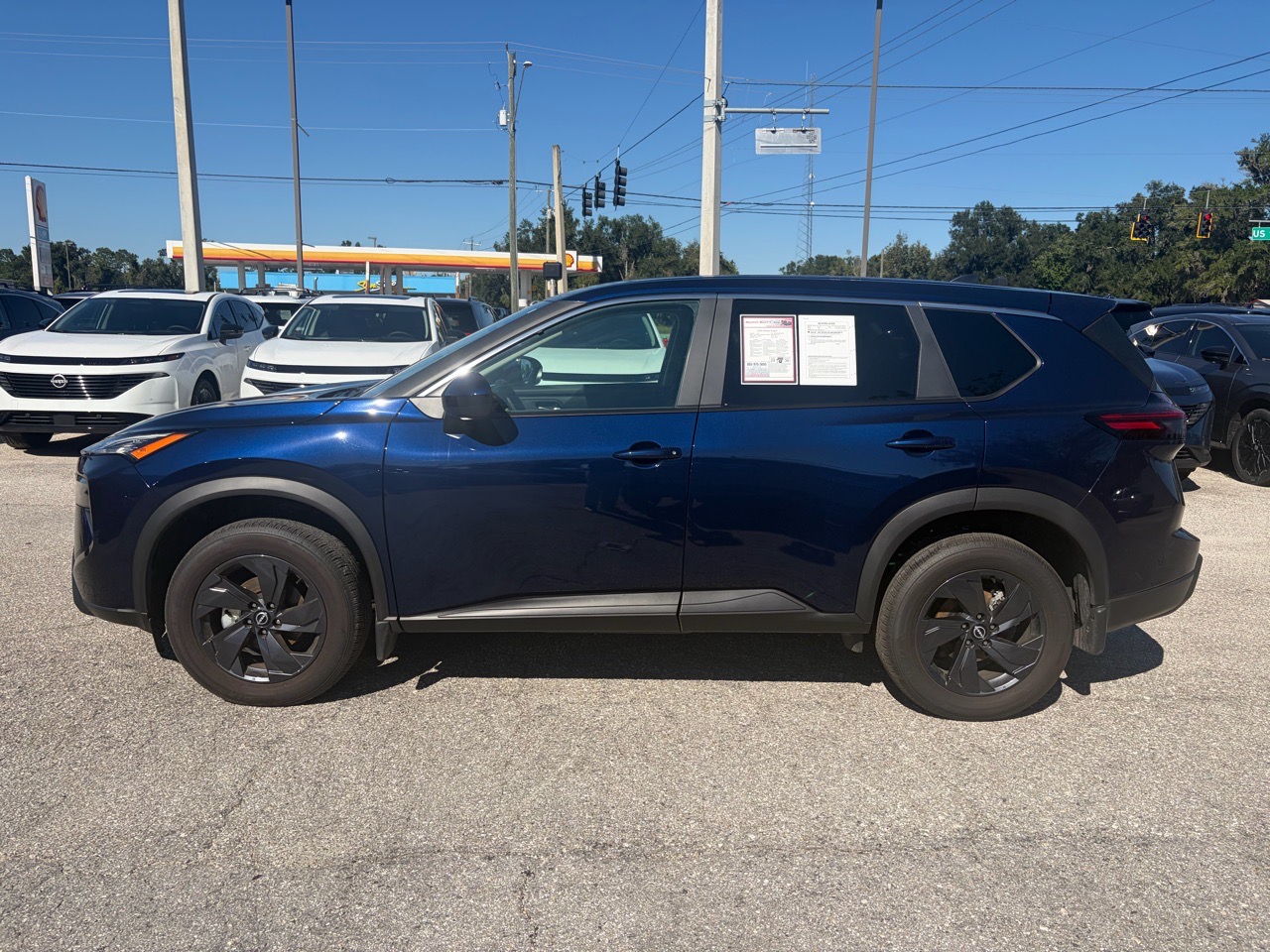 2026 Nissan Rogue SV — Deep Ocean Blue Pearl exterior view 4, for sale at Cbrasfield 36 in Lake City, FL