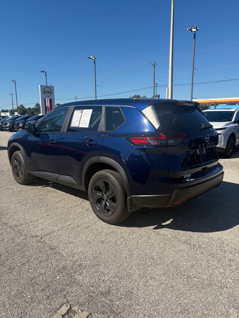 2026 Nissan Rogue SV — Deep Ocean Blue Pearl exterior view 5, for sale at Cbrasfield 36 in Lake City, FL