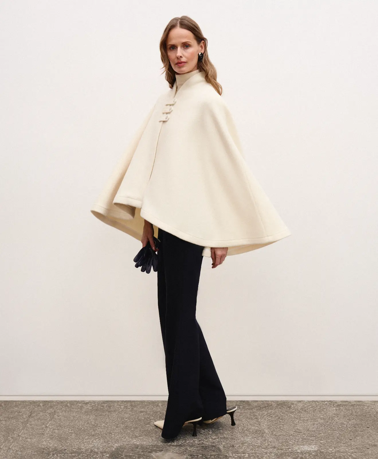 Creamy white wool and cashmere poncho Swan in a classic old money aesthetic