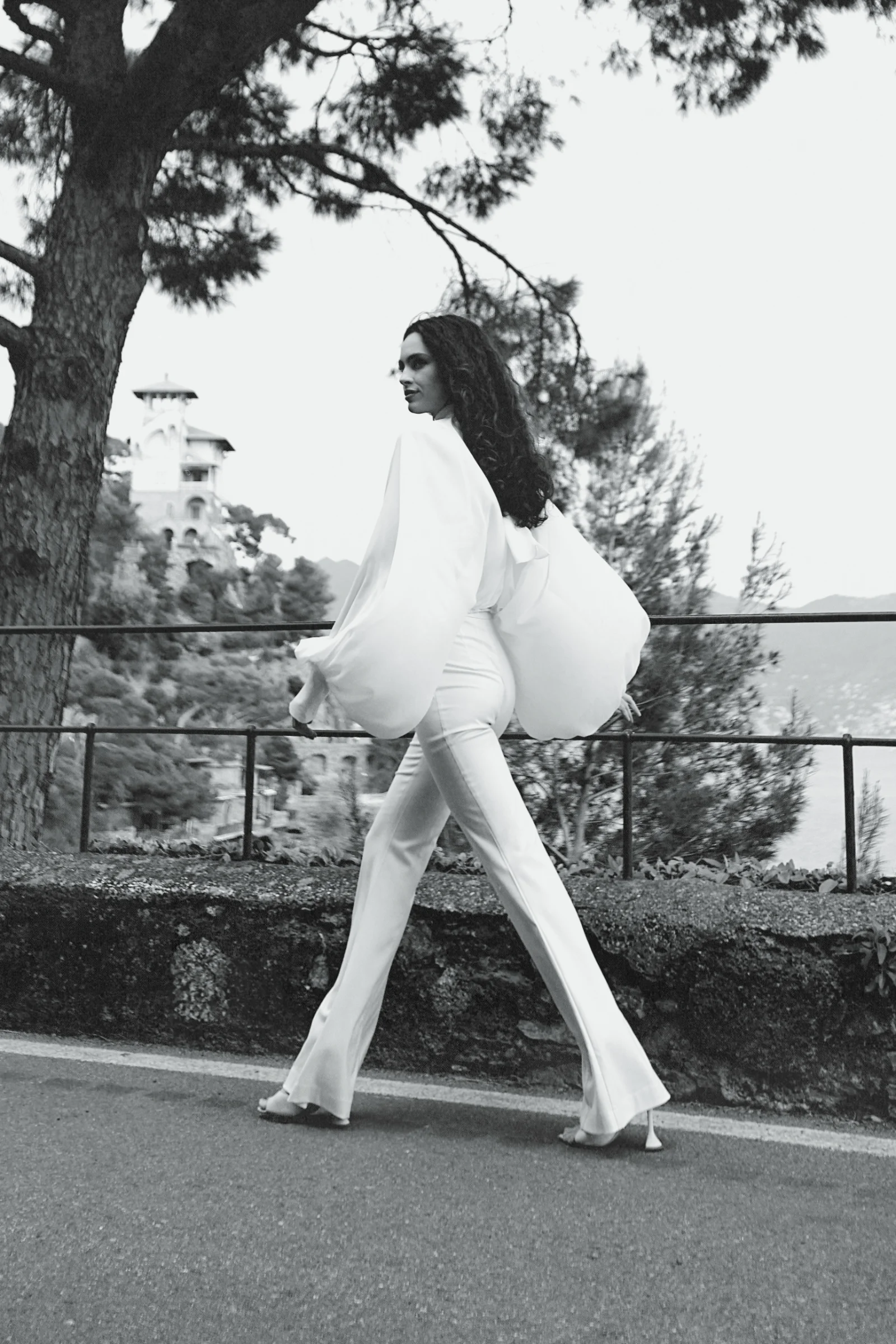 Designer white high-waisted flared Celeste trousers in quiet luxury aesthetic