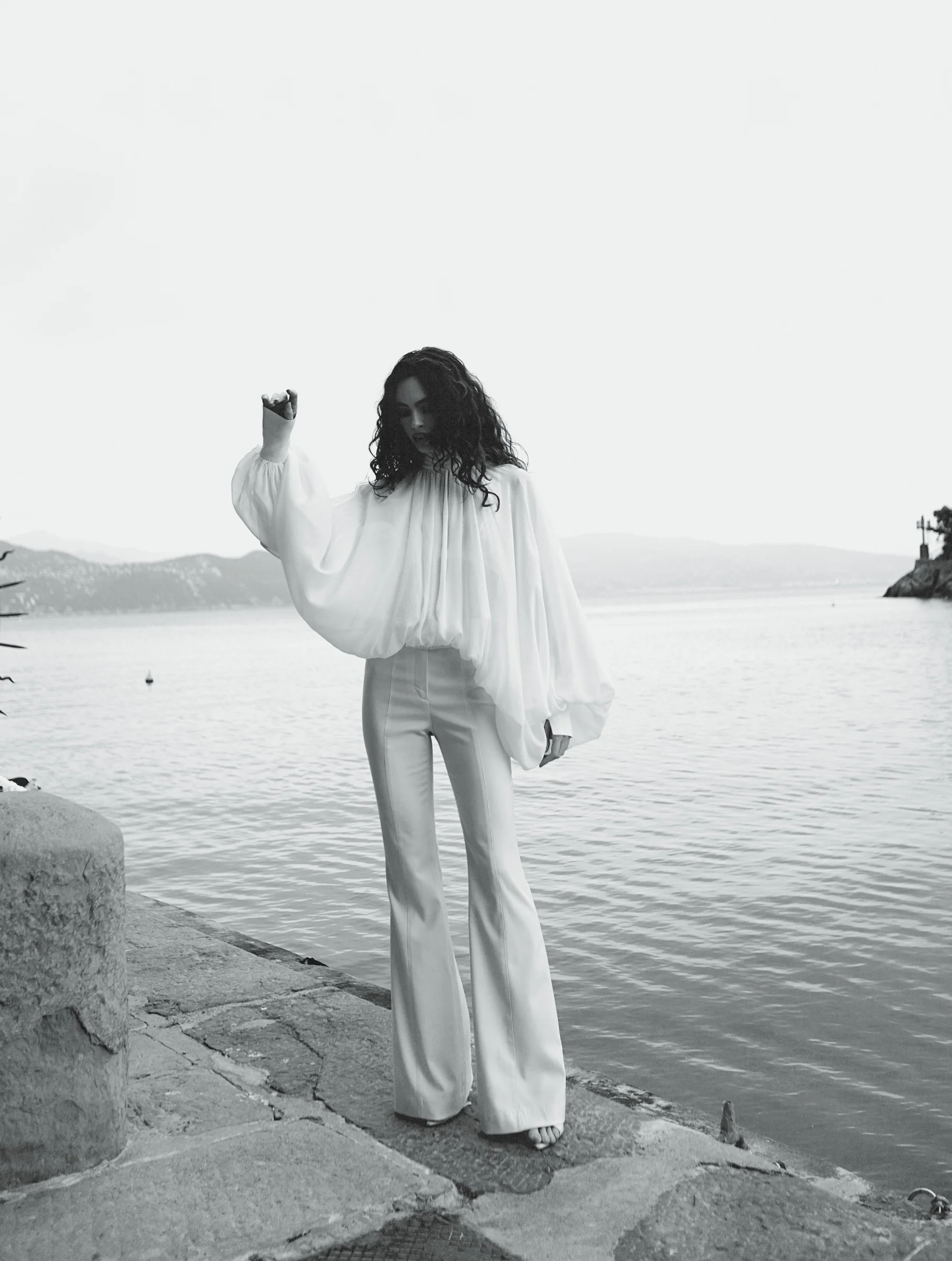 Designer white high-waisted flared Celeste trousers in quiet luxury aesthetic