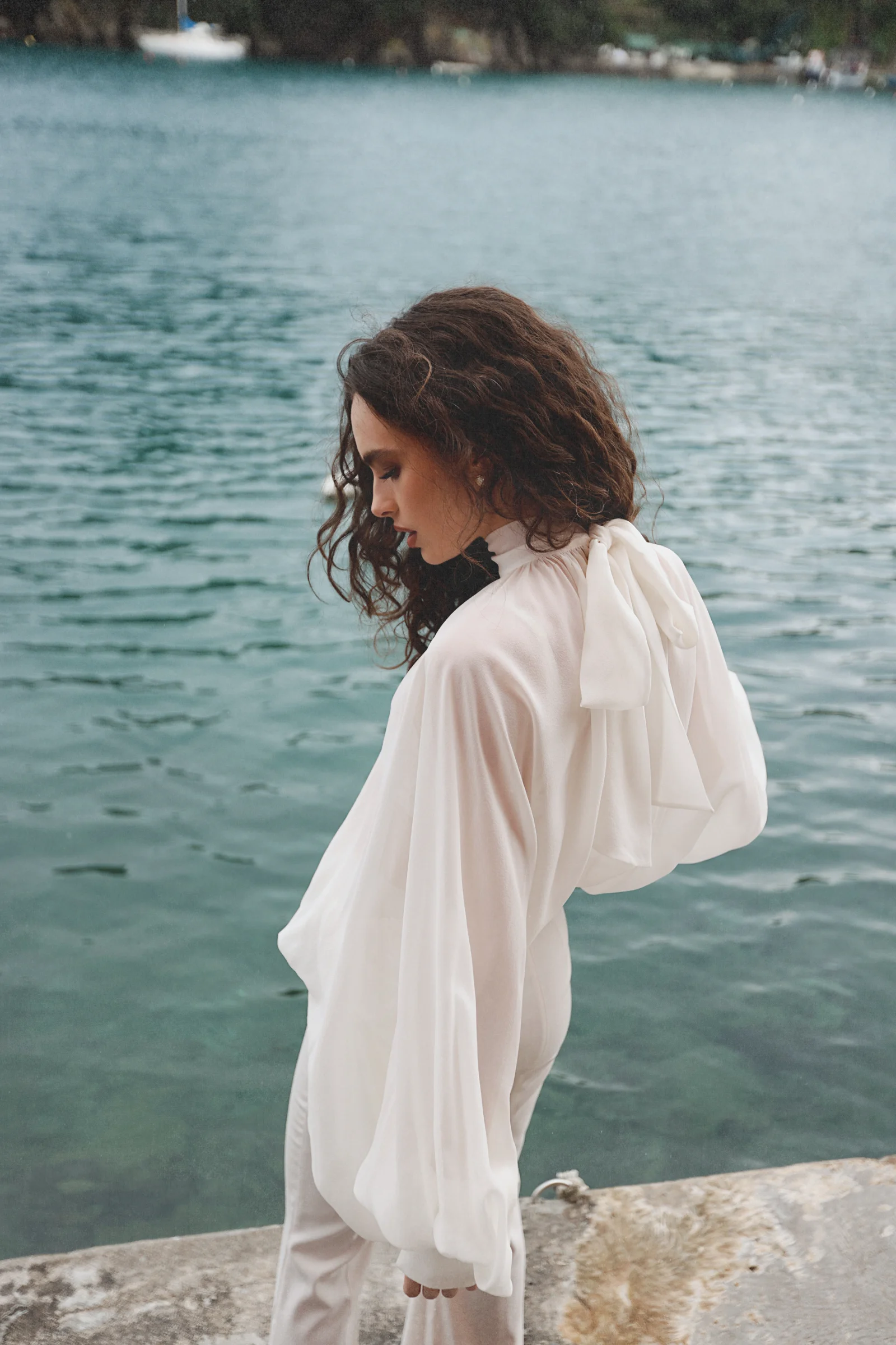 White silk blouse Dolce with voluminous sleeves, a fluid drape and scarf-neck detail