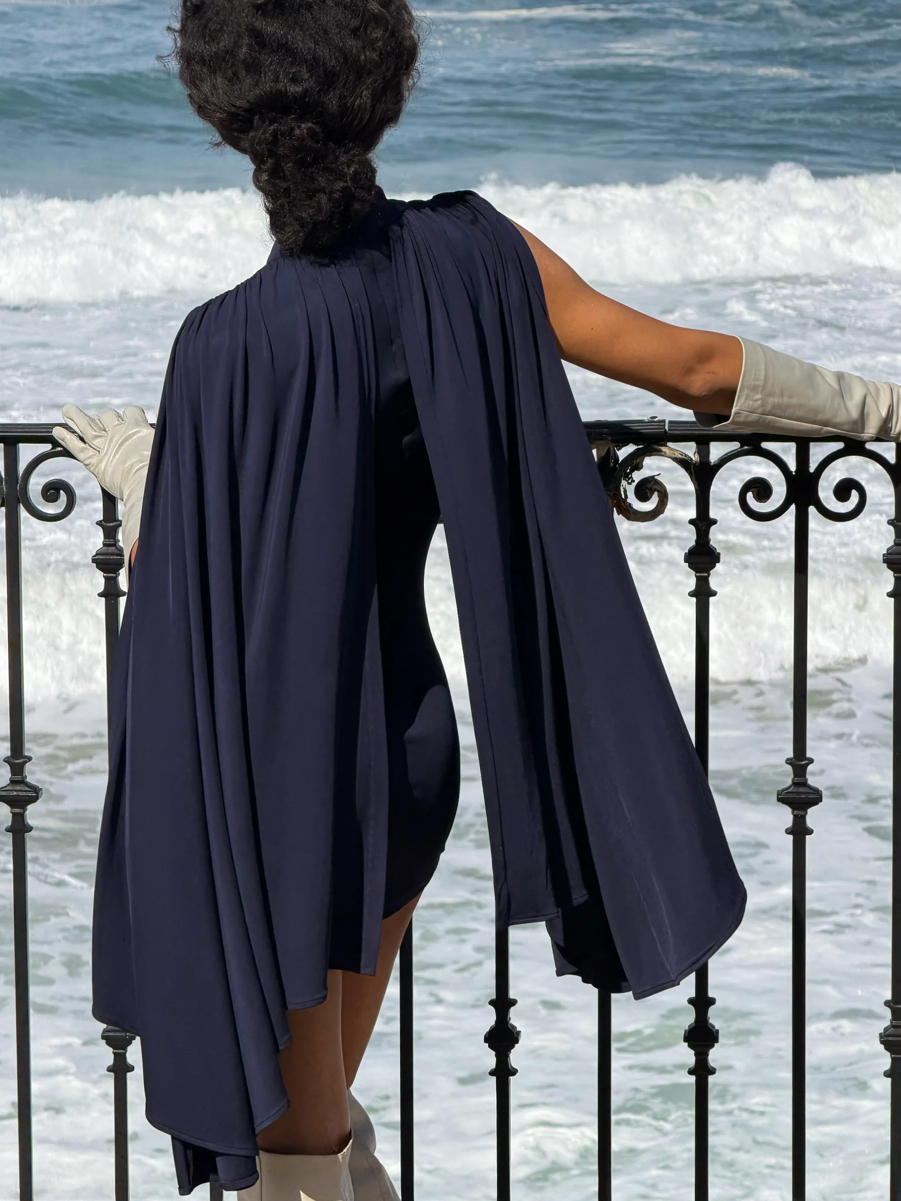 Sophisticated navy mini dress in old money aesthetic with cape 