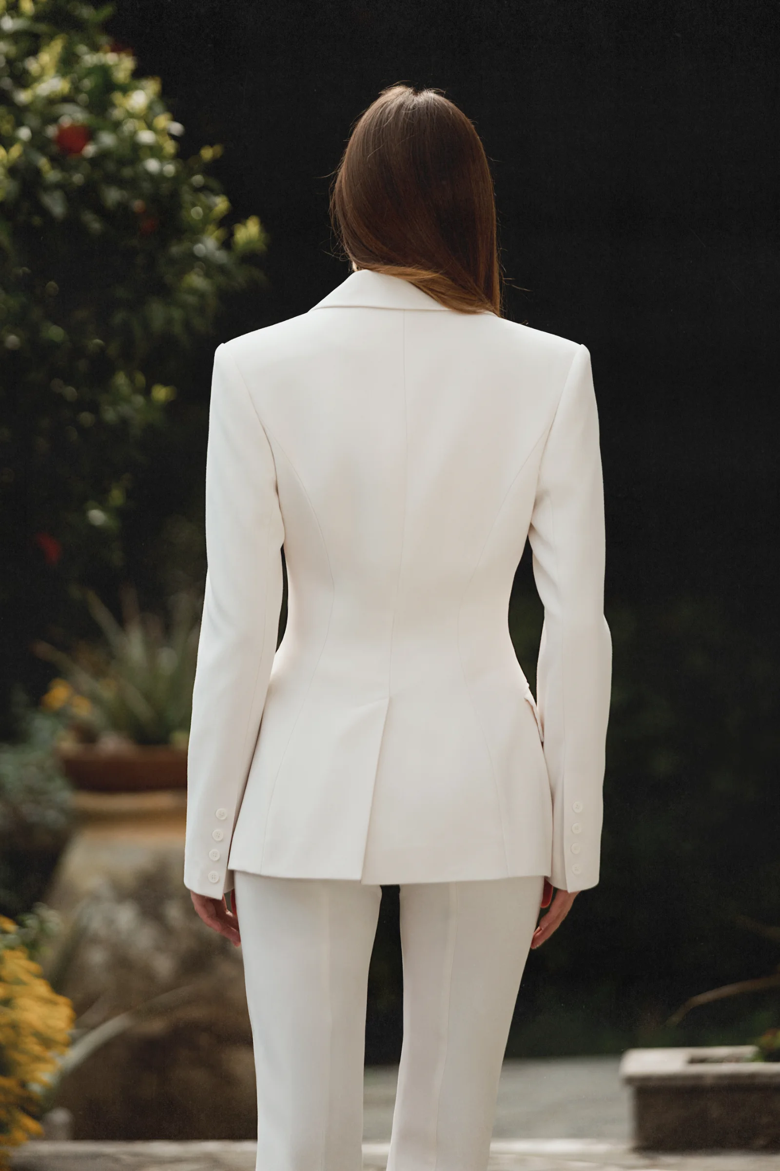 The designer white tailored jacket Celeste by Amarice with defined shoulders and a single button in quiet luxury style