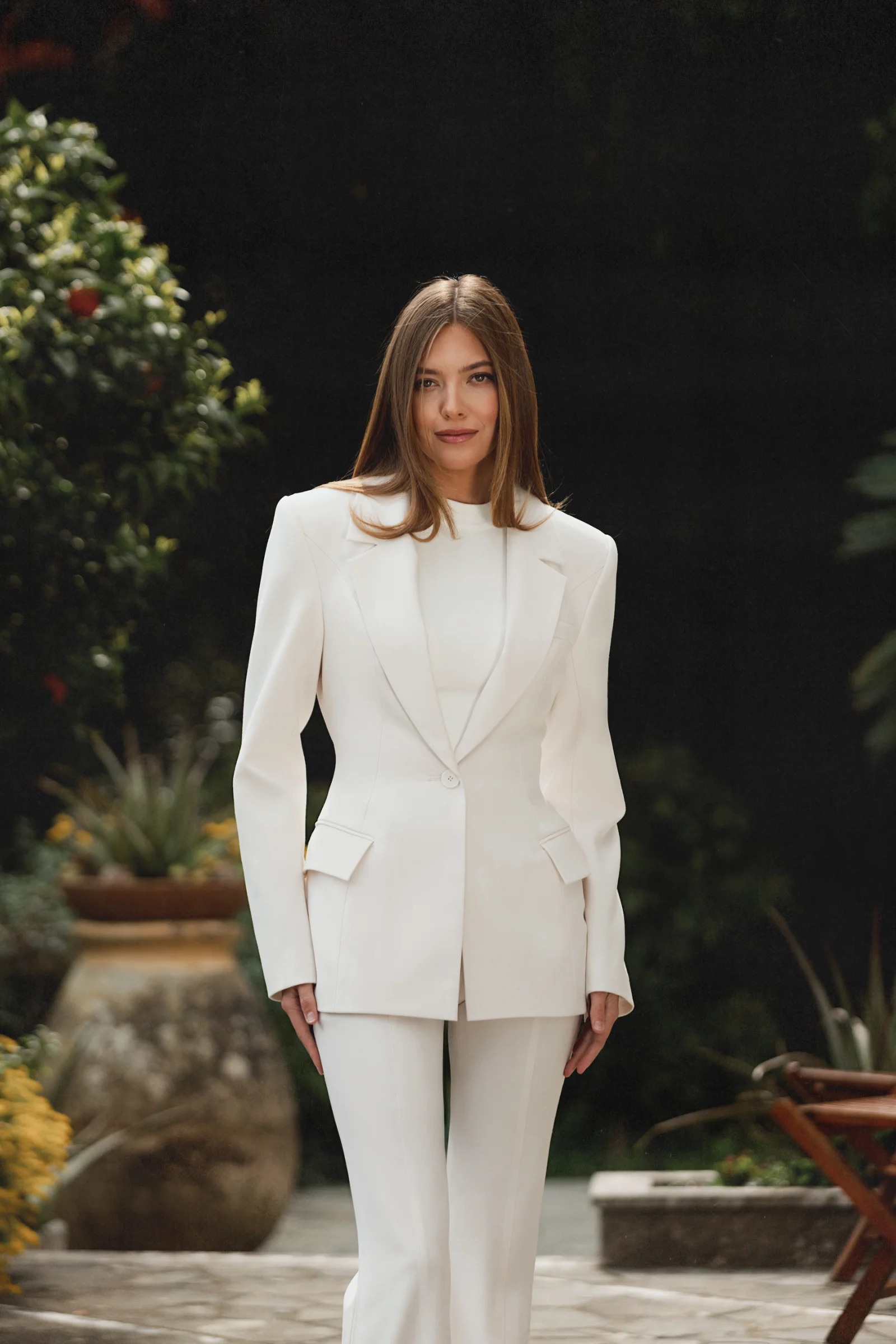 The designer white tailored jacket Celeste by Amarice with defined shoulders and a single button in quiet luxury style