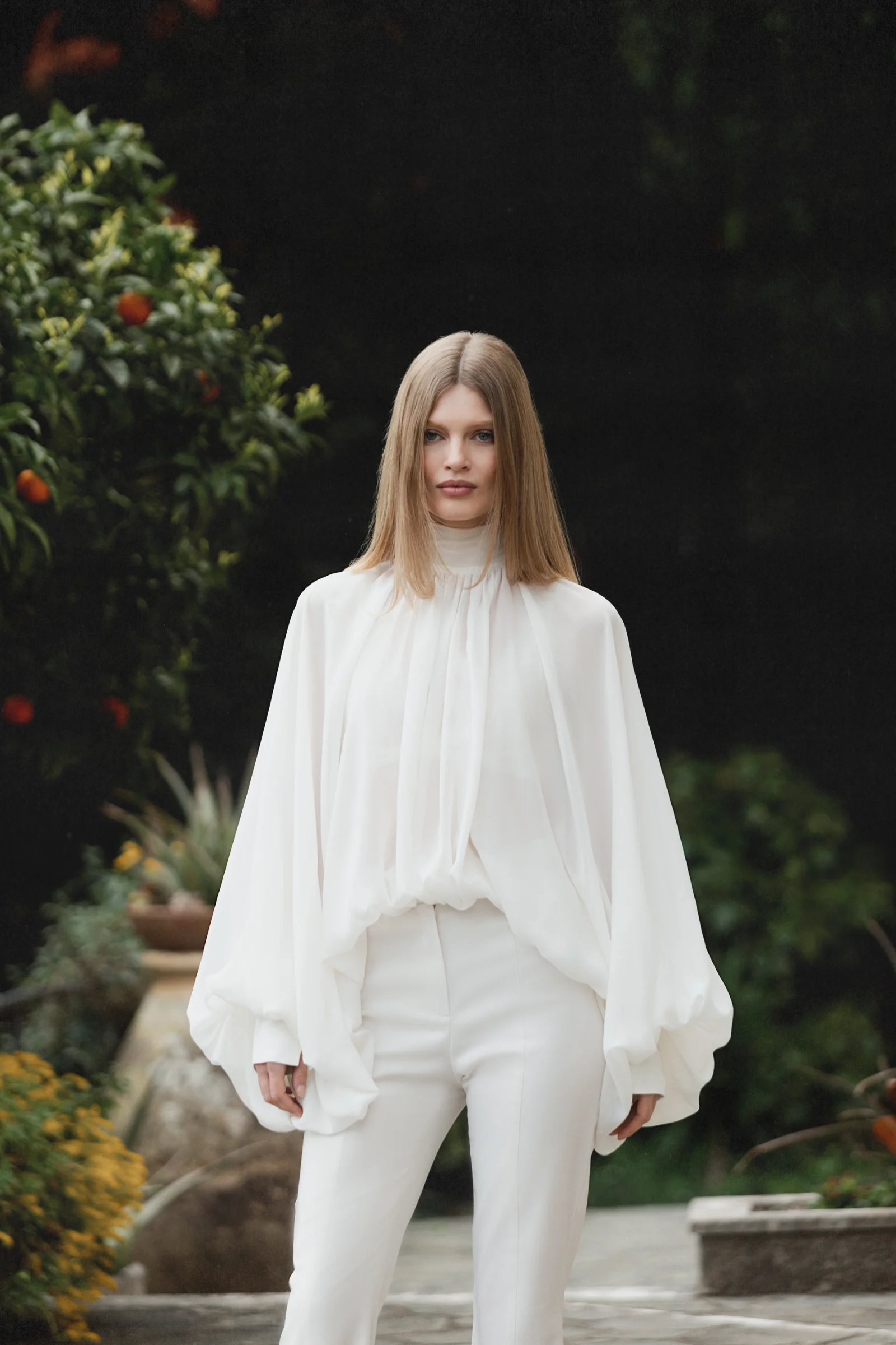 White silk blouse Dolce with voluminous sleeves, a fluid drape and scarf-neck detail