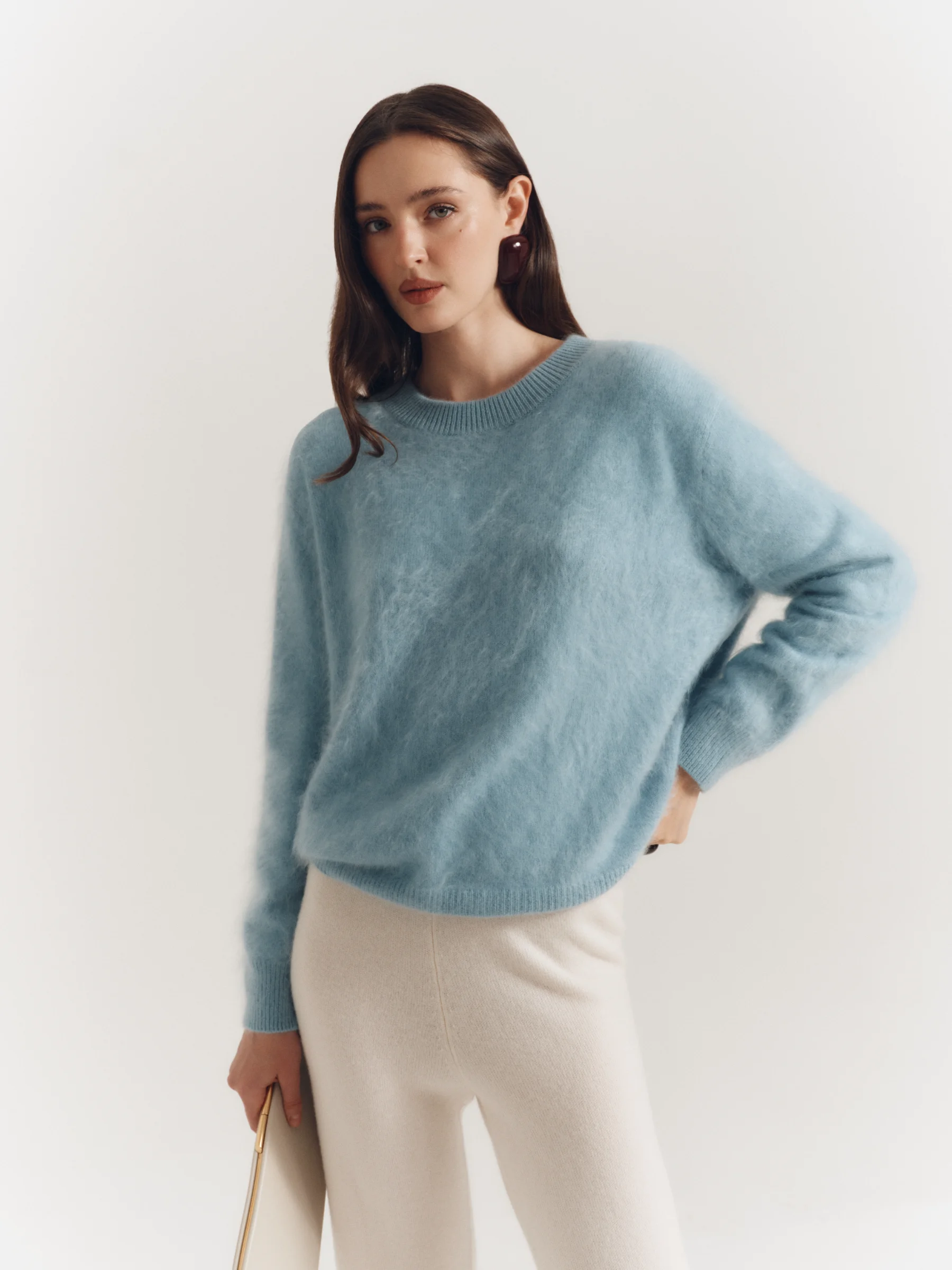 Women's light blue brushed cashmere sweater with ribbed neckline and cuffs