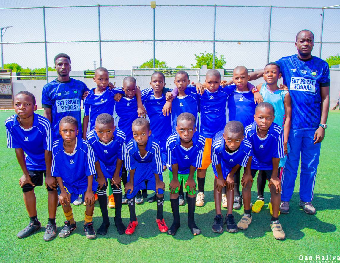 Kids posing with a trophy