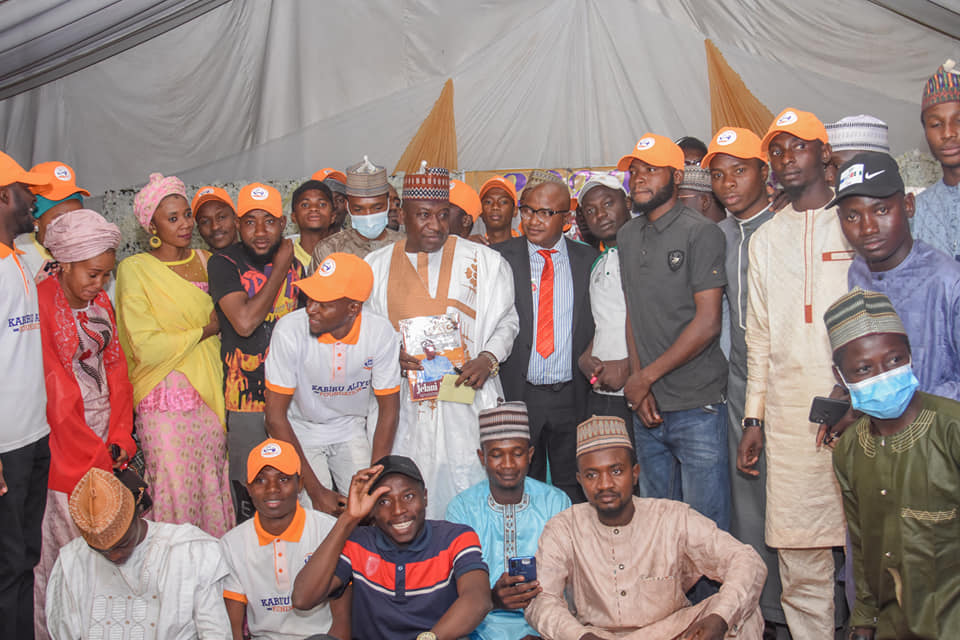 Photo of Dr Kabiru Aliyu receiving the award of Youths Developer of the Year