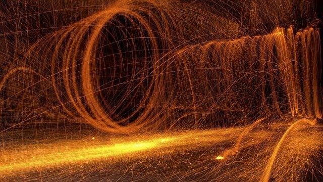 Photo showing fiery sparks making swirls and shapes