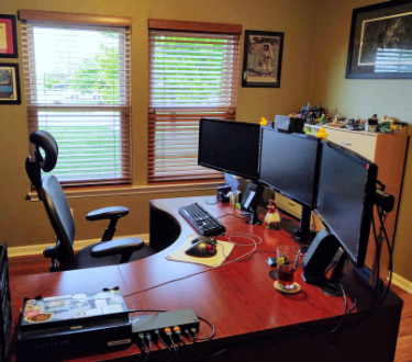 Photo of Michael's office showing windows to the left side of the desk