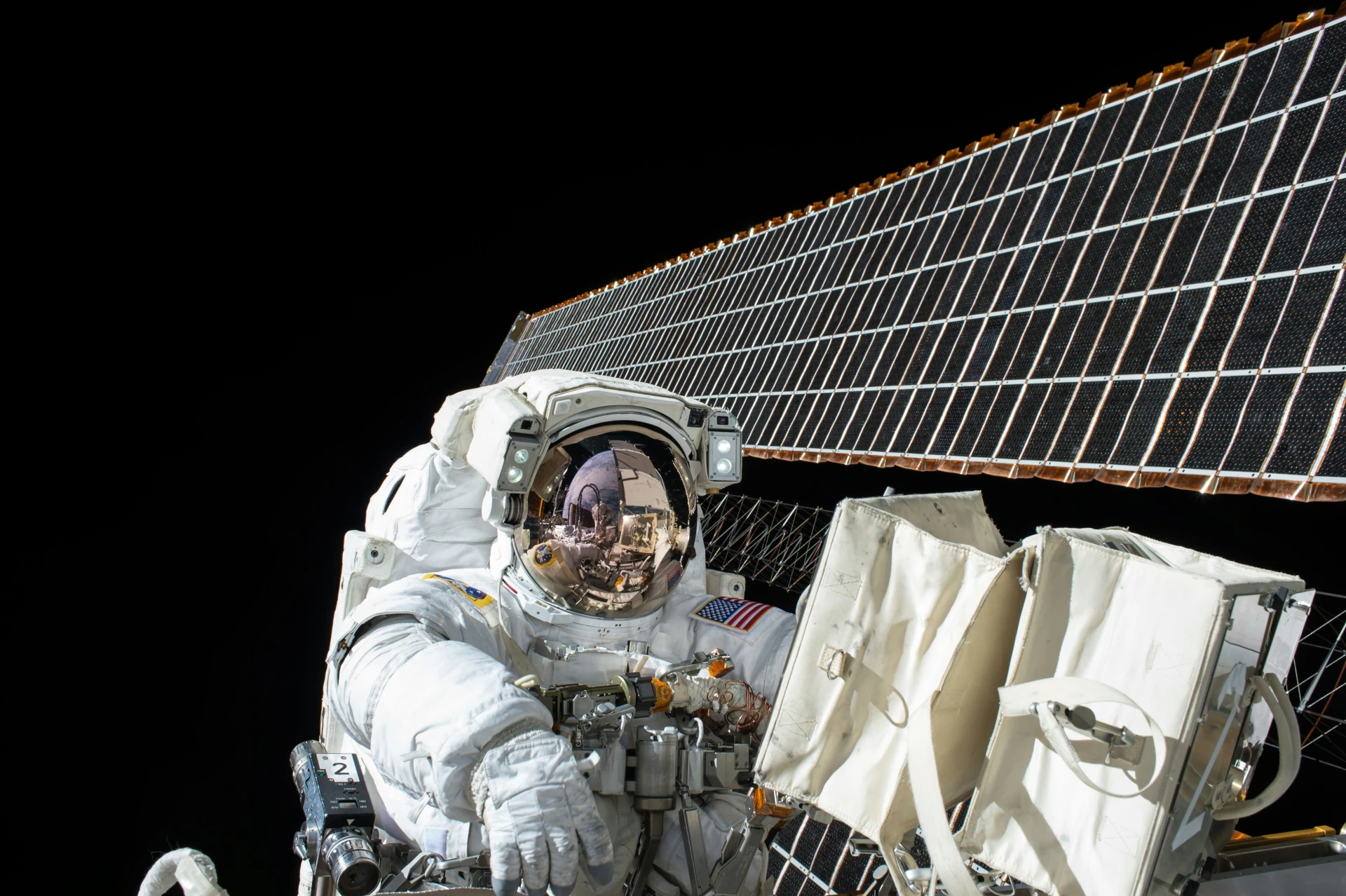 Astronaut in space working on a spacecraft's or station's solar panels