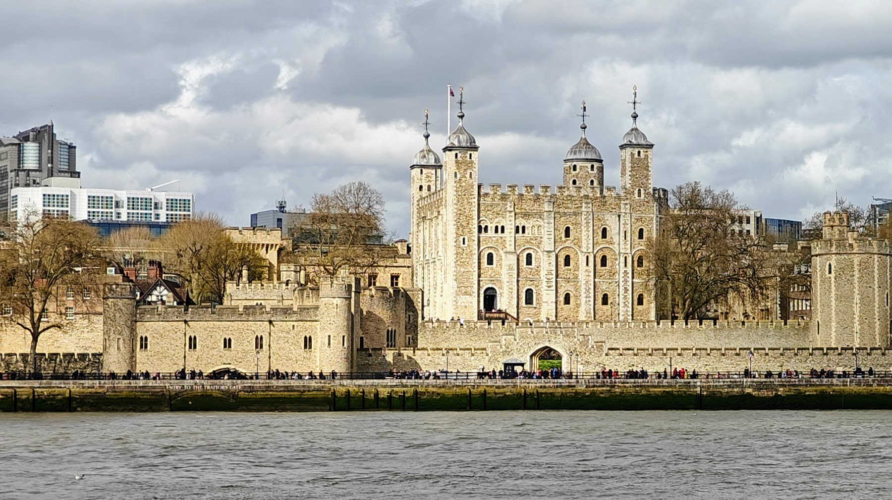 Photo of the Tower of London taken from across the river to show off the walls around the white tower