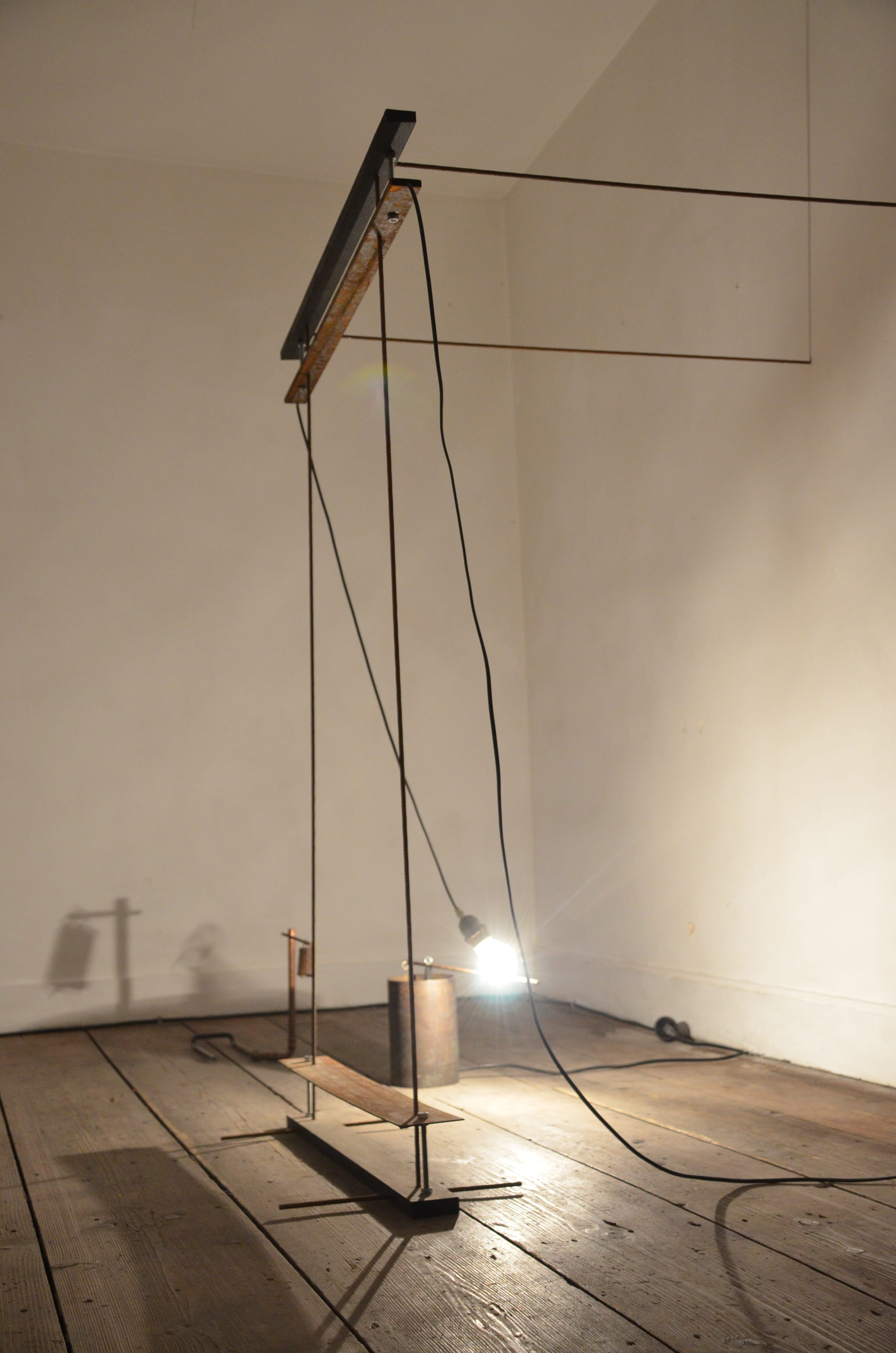 Light Bulb Hanging on a Cable Swinging Right | by Anna Godzina.