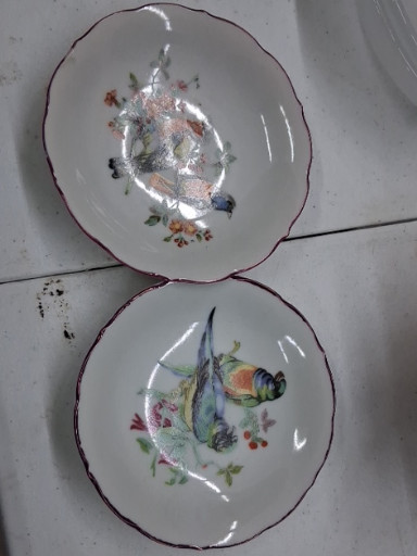 Pair of porcelain lusterware bowls with scalloped edges, floral and butterfly decoration