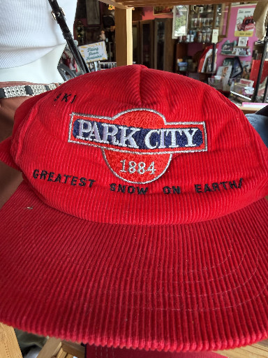 Vintage red corduroy snapback hat with embroidered 'Park City - Greatest Snow on Earth - 1884' logo