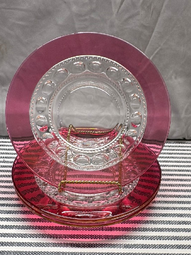 Ruby-flashed pressed glass luncheon plates in the 'Kings Crown' pattern by Indiana Glass