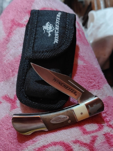 Winchester folding pocket knife with wood and brass handle in nylon sheath