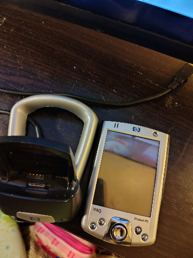 HP iPAQ Pocket PC h2210 PDA with charging cradle
