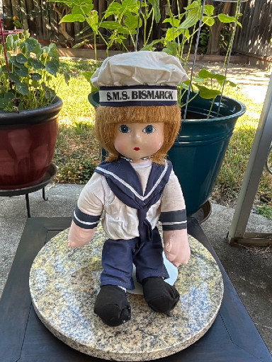 Cloth and porcelain sailor doll titled 'S.M.S. Bismarck' by Pauline Bjonness-Jacobsen Design.