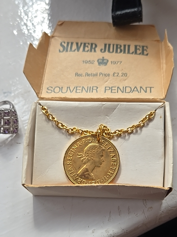Gold-plated coin necklace commemorating Queen Elizabeth II's Silver Jubilee (1952-1977)