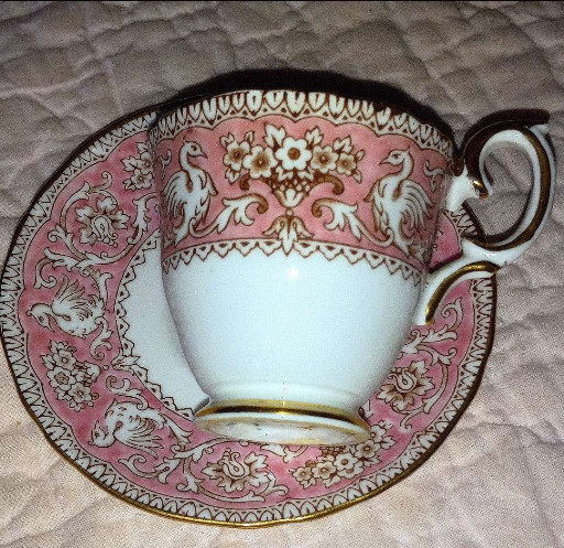 Bone china teacup and saucer in 'Ellesmere Pink' pattern by Crown Staffordshire