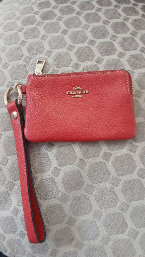 Red leather wristlet wallet by Coach