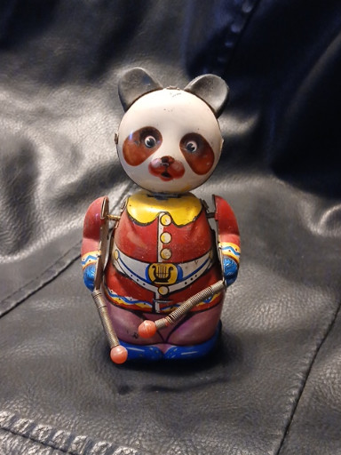 Vintage tin wind-up toy titled 'Drumming Panda' made in China