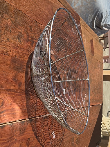 Wire basket made of metal with oval shape and handle