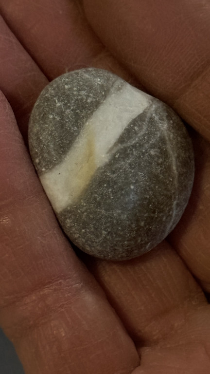 Natural banded beach stone with grey and white striping