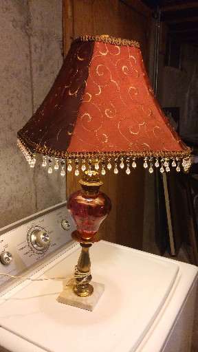 Vintage-style table lamp with cranberry red glass body, marble base, and embroidered fabric shade with beaded fringe