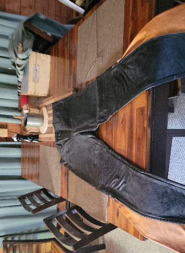 Black leather motorcycle pants with zippered legs worn once... maybe twice...size 32"x30"