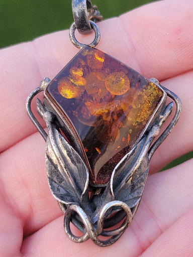 Sterling silver pendant with natural Baltic amber cabochon