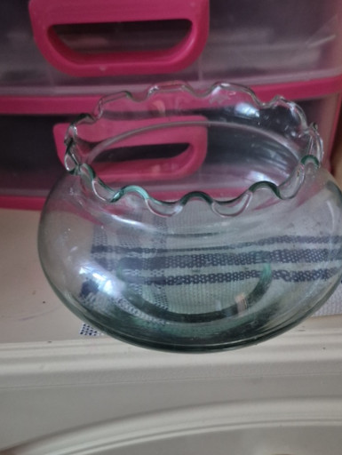 Hand-blown light green glass bowl with ruffled rim